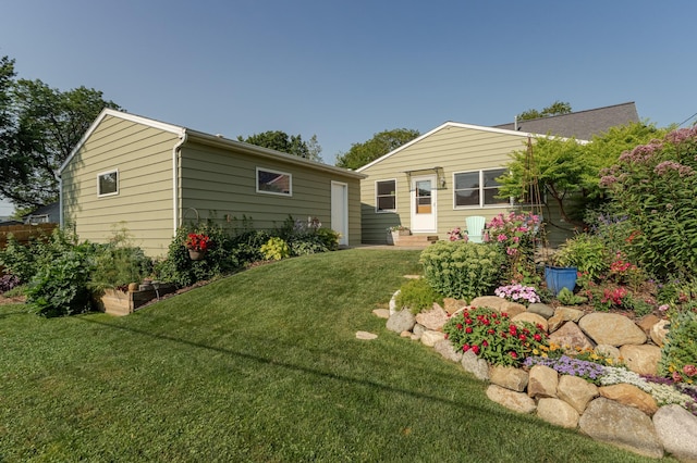 back of house featuring a yard