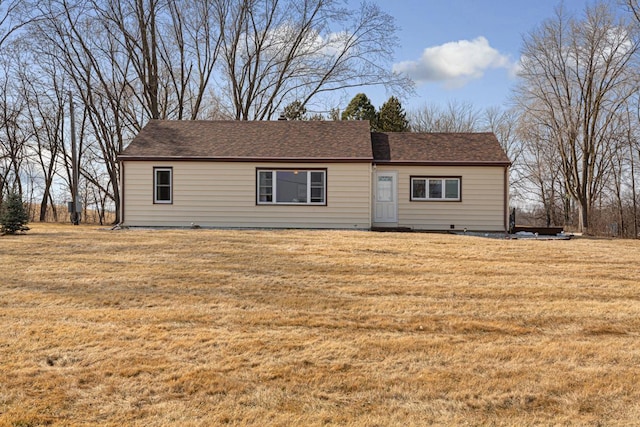 single story home featuring a front lawn and a shingled roof