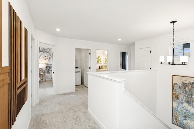 hallway featuring recessed lighting, baseboards, an upstairs landing, and light carpet