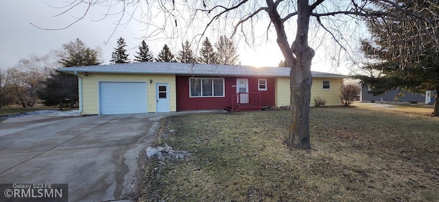 ranch-style home with driveway, a front lawn, and an attached garage