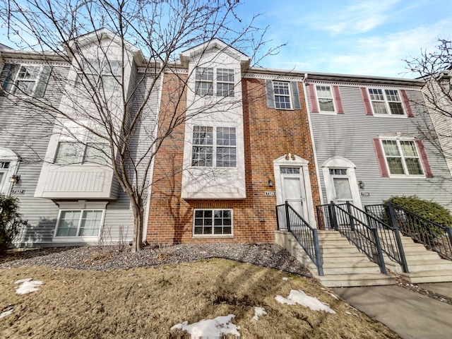 multi unit property featuring brick siding