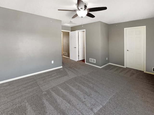 spare room featuring carpet, baseboards, and visible vents