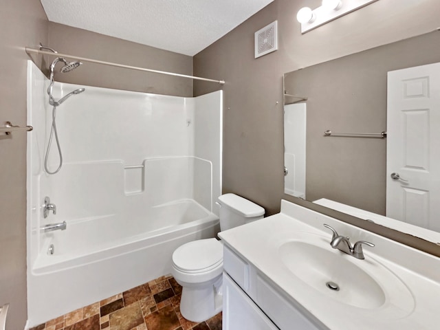 full bath with vanity, visible vents, a textured ceiling, bathing tub / shower combination, and toilet