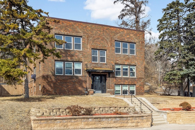 view of front of house with brick siding