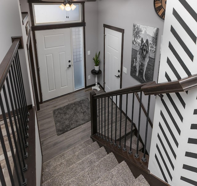 entrance foyer featuring wood finished floors and stairs