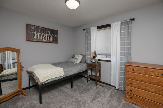 bedroom featuring baseboards and carpet flooring