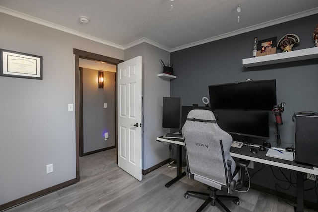 home office with crown molding, baseboards, and wood finished floors