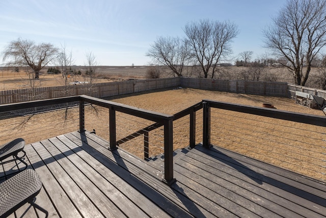 deck with a fenced backyard