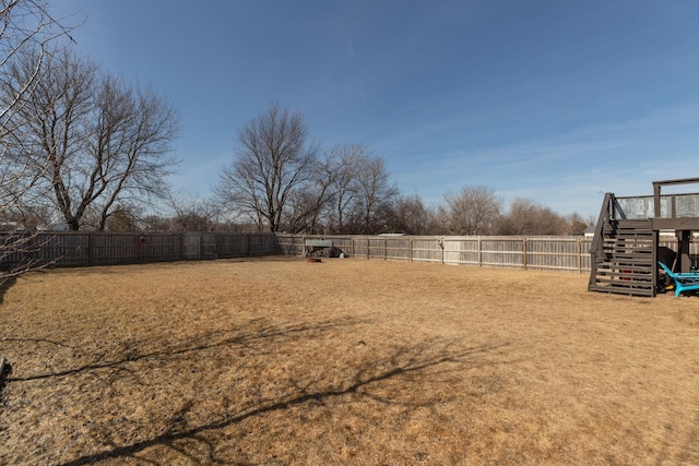 view of yard featuring a fenced backyard