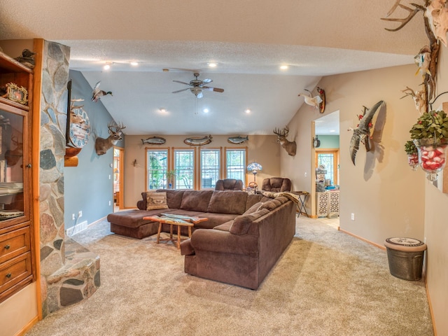 carpeted living area featuring a textured ceiling, baseboards, and vaulted ceiling