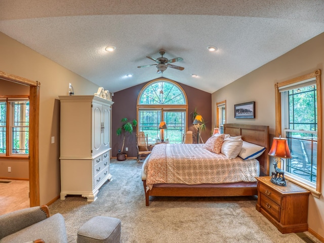 bedroom featuring light carpet, baseboards, and lofted ceiling