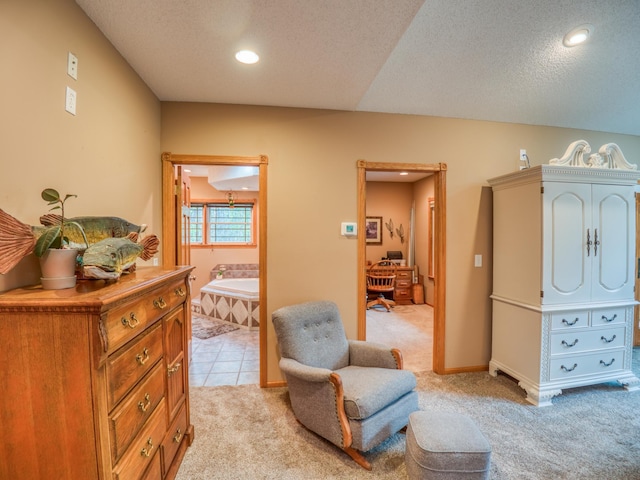 living area featuring light tile patterned flooring, light colored carpet, recessed lighting, and a textured ceiling