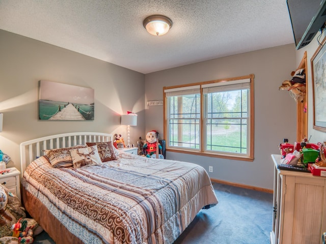 bedroom with a textured ceiling, baseboards, and carpet