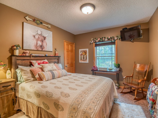 carpeted bedroom featuring a textured ceiling