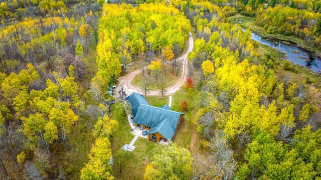 birds eye view of property with a forest view