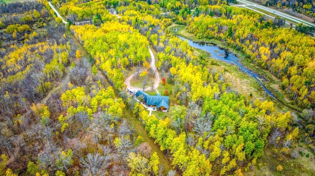 drone / aerial view with a water view and a view of trees