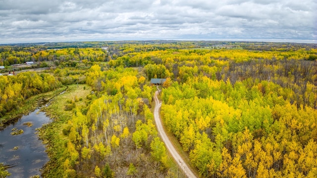 bird's eye view featuring a forest view