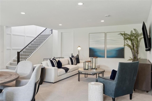 living room featuring light carpet, stairway, and recessed lighting