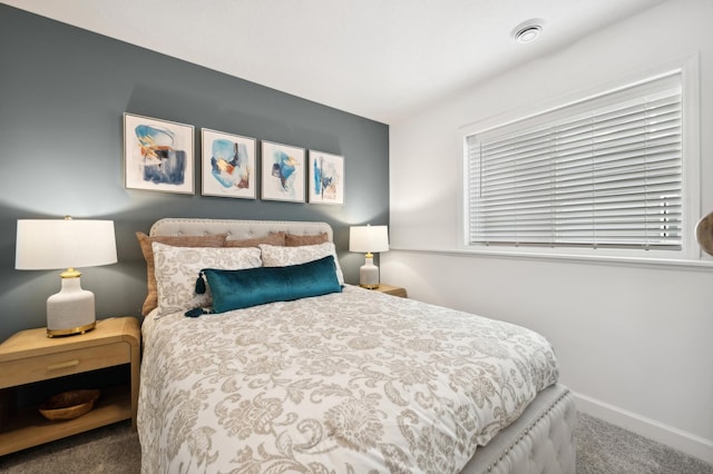 bedroom with baseboards, visible vents, and carpet floors