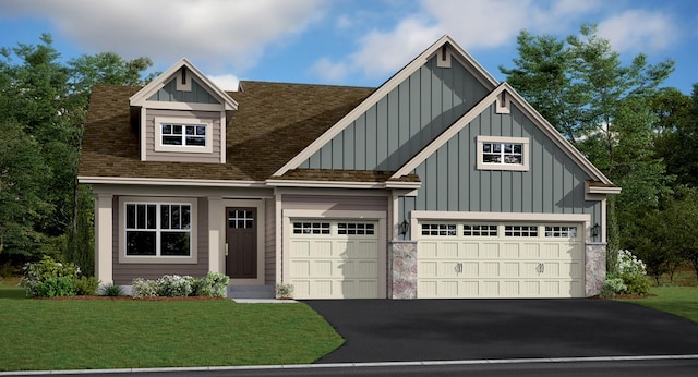 view of front of home with driveway, roof with shingles, a front lawn, a garage, and board and batten siding