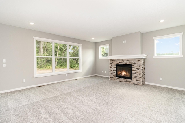 unfurnished living room with recessed lighting, visible vents, carpet floors, and baseboards