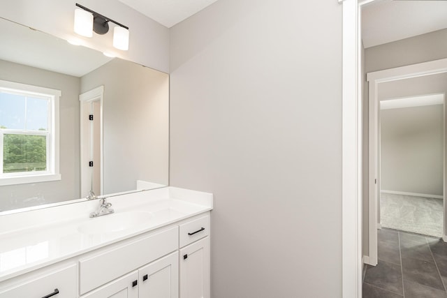 bathroom featuring vanity and baseboards