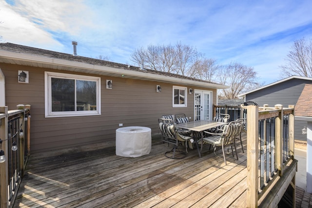 wooden terrace featuring outdoor dining area