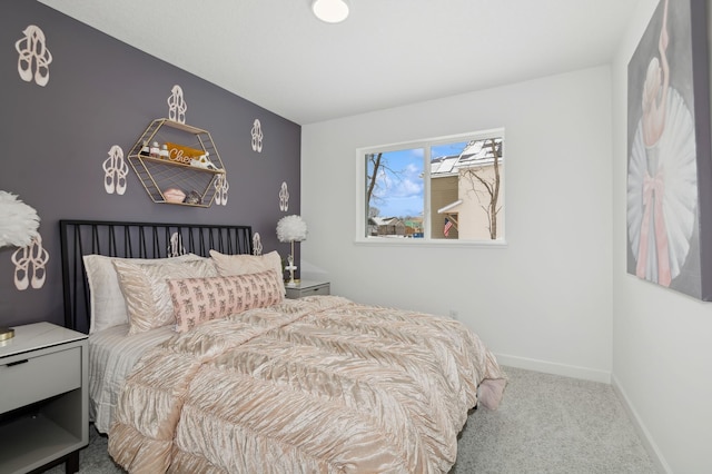 bedroom with carpet flooring and baseboards