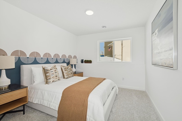 carpeted bedroom with baseboards