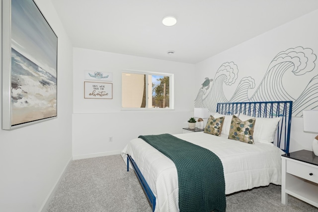 bedroom featuring carpet flooring and baseboards