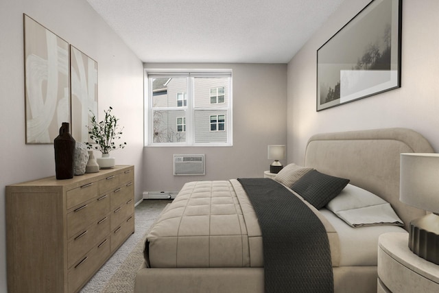 bedroom featuring baseboards, an AC wall unit, a textured ceiling, a baseboard heating unit, and light colored carpet