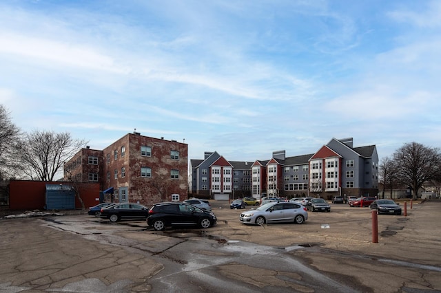 view of property featuring uncovered parking