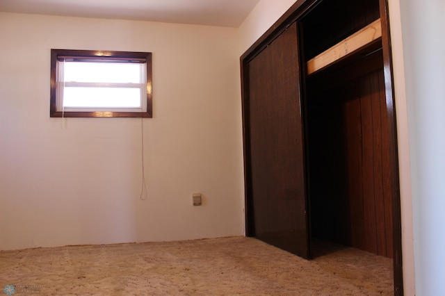203 4th St, Argusville, ND 58005 - unfurnished bedroom with a closet and carpet floors