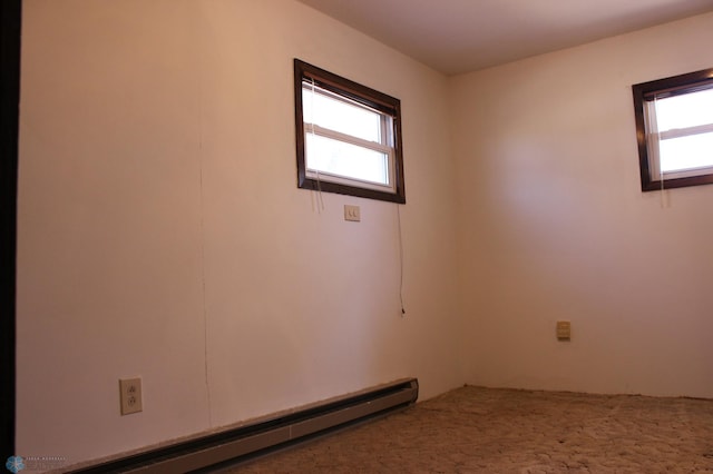 203 4th St, Argusville, ND 58005 - unfurnished room featuring a baseboard heating unit and plenty of natural light