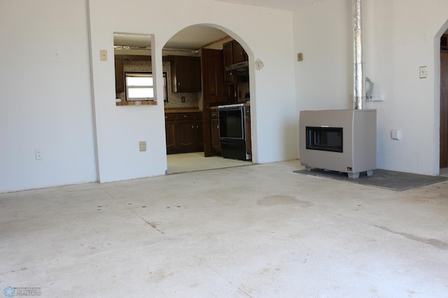 203 4th St, Argusville, ND 58005 - unfurnished living room with arched walkways and concrete floors