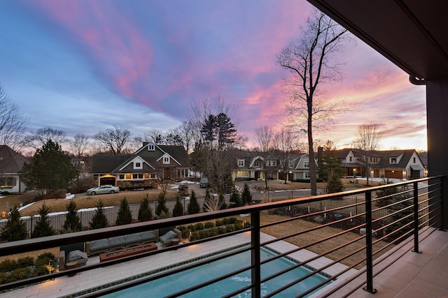 balcony at dusk with a residential view
