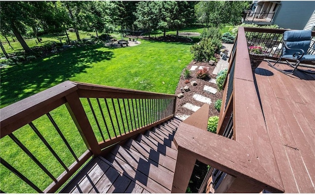 deck featuring a lawn