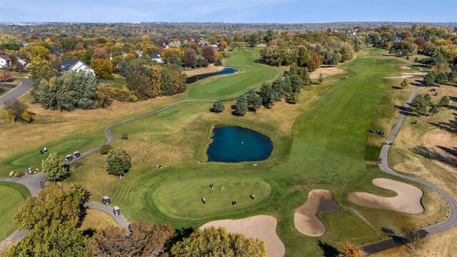 aerial view with a water view and view of golf course