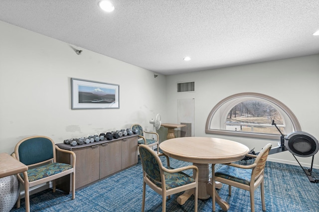 carpeted dining area with recessed lighting, visible vents, baseboards, and a textured ceiling