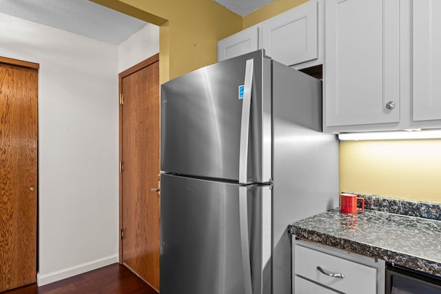 kitchen featuring white cabinetry, freestanding refrigerator, wine cooler, baseboards, and dark wood-style flooring