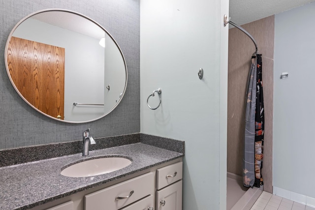 bathroom with tile patterned flooring, vanity, and a shower with shower curtain