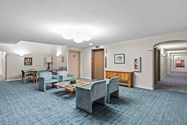 living area with elevator, carpet, arched walkways, and baseboards