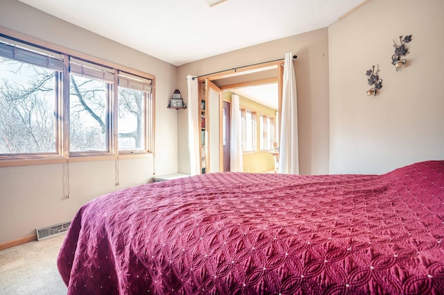 bedroom featuring visible vents and carpet