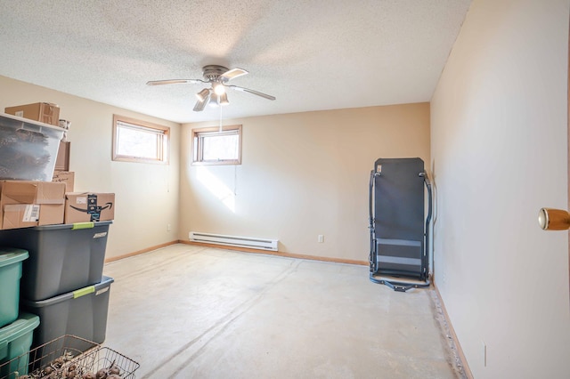 interior space with concrete floors, baseboards, baseboard heating, a textured ceiling, and a ceiling fan