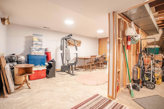 finished below grade area with recessed lighting, visible vents, and baseboards