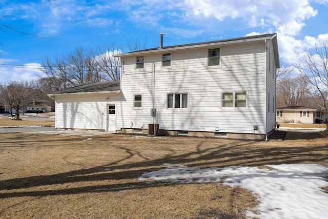 back of property featuring central AC