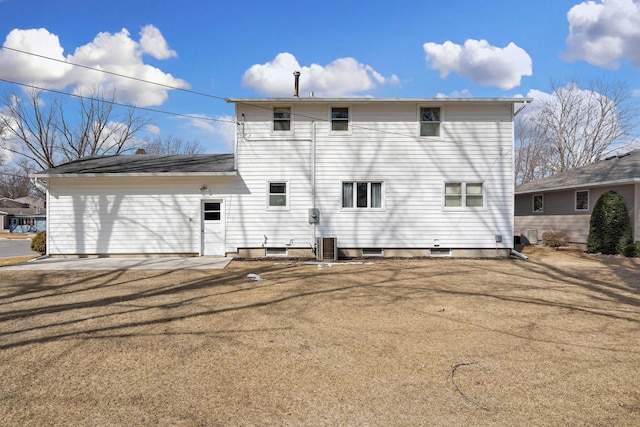 back of house featuring central AC unit