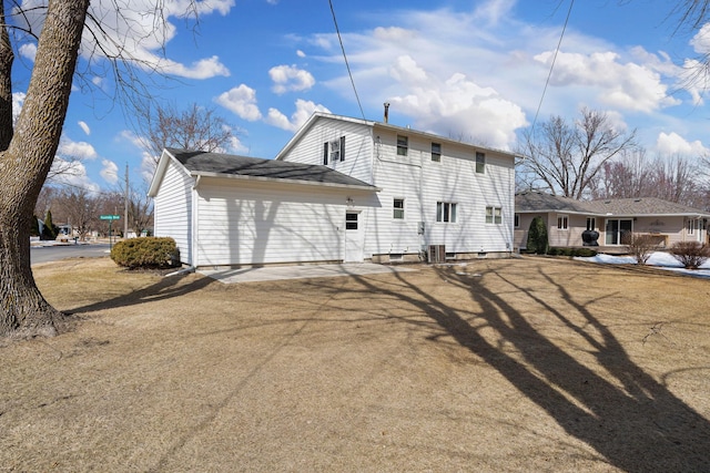 rear view of house with central air condition unit