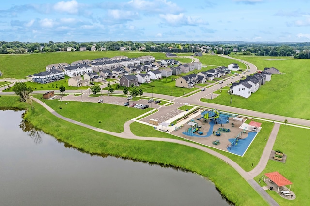 drone / aerial view with a residential view and a water view