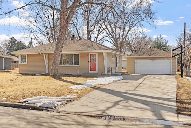 view of front facade featuring a detached garage, entry steps, roof with shingles, an outdoor structure, and crawl space